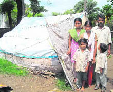 Ashok Kumar along with his three daughters and a son near their temporary shelter at Badhori village in Vijaypur block.