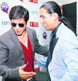 Actor Shahrukh Khan with Dean of IIPM Arindam Chaudhuri at the finals of International B-School Quiz-DARE 2009 at IIPM in New Delhi.