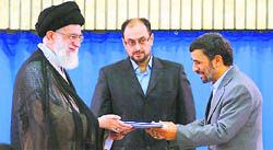 Irans supreme leader Ayatollah Ali Khamenei (left) presents a decree to Iranian President Mahmoud Ahmadinejad during an official ceremony in Tehran on Monday. 