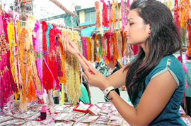 A girl looks at rakhis at Paltan Bazaar in Dehradun on Tuesday.
