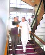 Chief Minister Prem Kumar Dhumal and opposition leader Kaul Singh Thakur coming down for the lunch break during the monsoon session of the Himachal Vidhan Sabha at Shimla