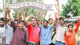 College students protest in front of Government MAM College in Jammu on Tuesday.