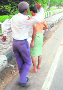 A mentally challenged person being shooed away by a traffic cop in Ludhiana.