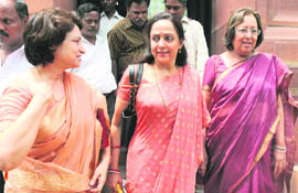 Rajya Sabha MPs Maya Singh, Hema Malini and Nazma Heptulla outside Parliament in New Delhi on Tuesday.