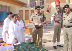 Brahmakumari sisters presenting gifts to DIG Vimal Satyarthi at the BSF sector headquarters near Abohar during the Raksha Bandhan celebrations.