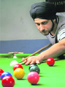 Gurjit Kohli plays a shot during a snooker match in Panchkula on Wednesday.