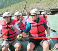 Chief Minister Omar Abdullah rafts through the Chenab at Sonamarg on Wednesday