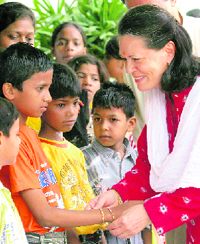 UPA chairperson Sonia Gandhi tying rakhi on the wrist of a child during celebration of Raksha Bandhan festival at her residence in New Delhi on Wednesday.