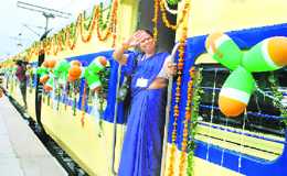 A woman boards the new ladies special train in New Delhi on Wednesday.