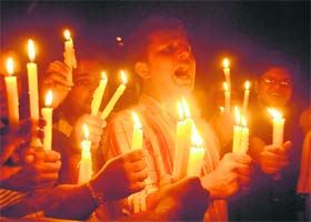 ABVP activists take out a candlelight procession in remembrance of atomic bomb victims on the 64th anniversary of the bombing of Hiroshima at Panjab University