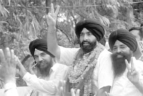 Jagjit Singh Bunny flashes a victory sign after winning the bypoll in Banur