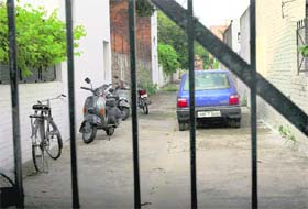 Vehicles parked in a back alley in Sector 21, Chandigarh