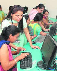 A computer workshop being organised for mothers at Saupins School in Mohali