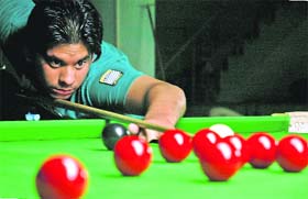 A player aims a shot during a snooker meet in Panchkula
