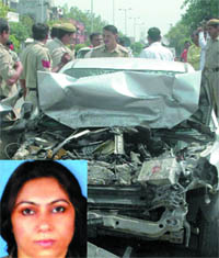 Policemen inspect the site where Neera Kharbanda (inset) was found dead at Rohini in New Delhi on Thursday.