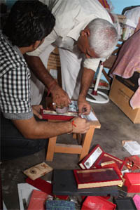 Investigation officials inspect the spot where robbery worth lakhs took place at New Colony in Gurgaon on Thursday.