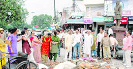 UKD workers block Clock Tower Road in Dehradun on Thursday. 