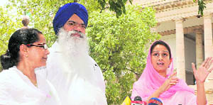 SAD MPs Harsimrat Kaur (R) with Paramjeet Kaur Gulshan (L) and Rattan Singh Ajnala talk to mediapersons in New Delhi on Thursday.