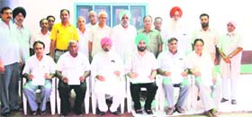 Members of the arhtiya association display the copies of resolutions handed over by the farmers in Jagraon