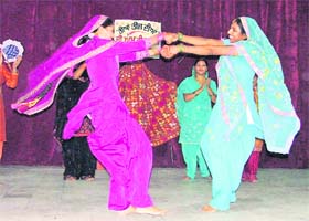 Girls take part in a cultural programme on the eve of Teej in Ludhiana