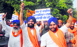 Members of the Jathedar Mohan Singh Tur Welfare Society raise slogans against the Haryana Government in Sector 17, Chandigarh, on Friday.