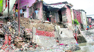 Houses damaged in Govindgarh on the banks of the Bindal.