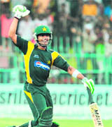 Umar Akmal celebrates his maiden century during the fourth ODI against Sri Lanka at The R Premadasa Stadium in Colombo on  Friday.