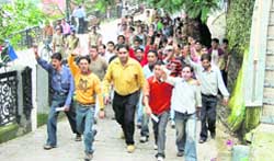 Students of MPG College protest outside the SDMs office in Mussoorie 