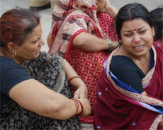 Grieving family members of Rishipal, a newspaper agent, who was shot dead in Gurgaon on Saturday. 