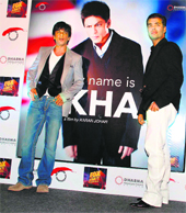 Bollywood star Shahrukh Khan and director Karan Johar pose at a news conference to announce a distribution deal with Fox Star Studios for their upcoming movie My Name is Khan, in Mumbai.