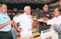 Defence Minister AK Antony talks to Army chief General Deepak Kapoor, Navy head Admiral Sureesh Mehta and IAF chief Air Chief Marshal PV Naik at the inauguration of armed forces tribunal in New Delhi 