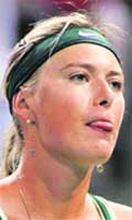Maria Sharapova reacts after double faulting against Urszula Radwanska during their match at the LA Womens Tennis Championships in Carson, California