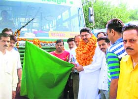Nurpur MLA Rakesh Pathania flagging off the Jassur-Pinjore bus service
