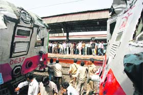 Four persons were injured as two local trains collided in Mumbai