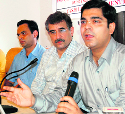 Dr Vikram Gulati  (right), vascular interventional  radiologist, addresses a press conference in Amritsar on Sunday. 