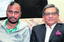 External Affairs Minister SM Krishna (R) with Indian student Shravan Thrthala, who was attacked and stabbed with a screwdriver, in Melbourne on Sunday. 