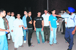 Members of the Afghan Students Association outside the mortuary at the PGI in Chandigarh on Monday waiting for the police to complete its formalities to release the body.