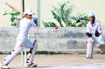 Players in action during the Eugene Saupins Cricket Tournament for under-10 in Chandigarh on Monday.