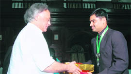Union minister for environment and forest Jairam Ramesh hands over the All Rounder Outstanding Performance award to Vishwesh Kumar, the passing out India Forest Service probationer, at the covocation ceremony in Dehradun on Monday.