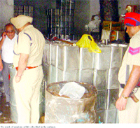 Policemen during a raid on the godown in Hoshiarpur.