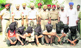 The eight members of a gang of tubewell motor thieves in police custody at Jagraon.
