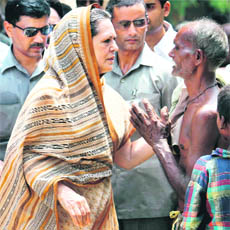 UPA chairperson Sonia Gandhi meets villagers during her visit to Rae Bareli on Monday.