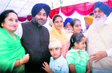 Newly appointed Deputy CM Sukhbir Badal with his father and CM Parkash Singh Badal, mother Surinder Kaur Badal, MP wife Harsimrat Kaur and children in Chandigarh on Monday.