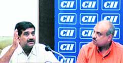 Home Secretary Ram Niwas, along with chairman of CII Chandigarh Council, Partap Aggarwal, addresses a press conference in Chandigarh