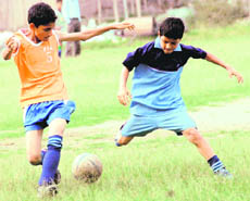 The quarterfinal between St Joseph Academy and Guru Nanak Academy in progress in Dehradun on Tuesday.