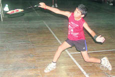 Tushar plays a shot at the Dehradun District Badminton Championship on Tuesday.