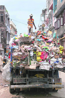 An MC vehicle collects garbage from a house in Jammu. 