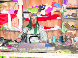 Shams-ud-Din, who made at least six militants lay arms, in his shop in Bani. Photo by the writer