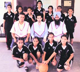 The basketball team of St Mahapragya’s School, along with coaches, after winning the zonal basketball tournament held at Gureh village