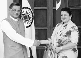 External Affairs Minister SM Krishna with his Nepali counterpart Sujata Koirala before a meeting in New Delhi